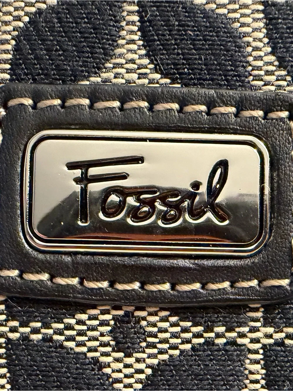 Fossil monogram canvas wristlet/wallet with leather trim.